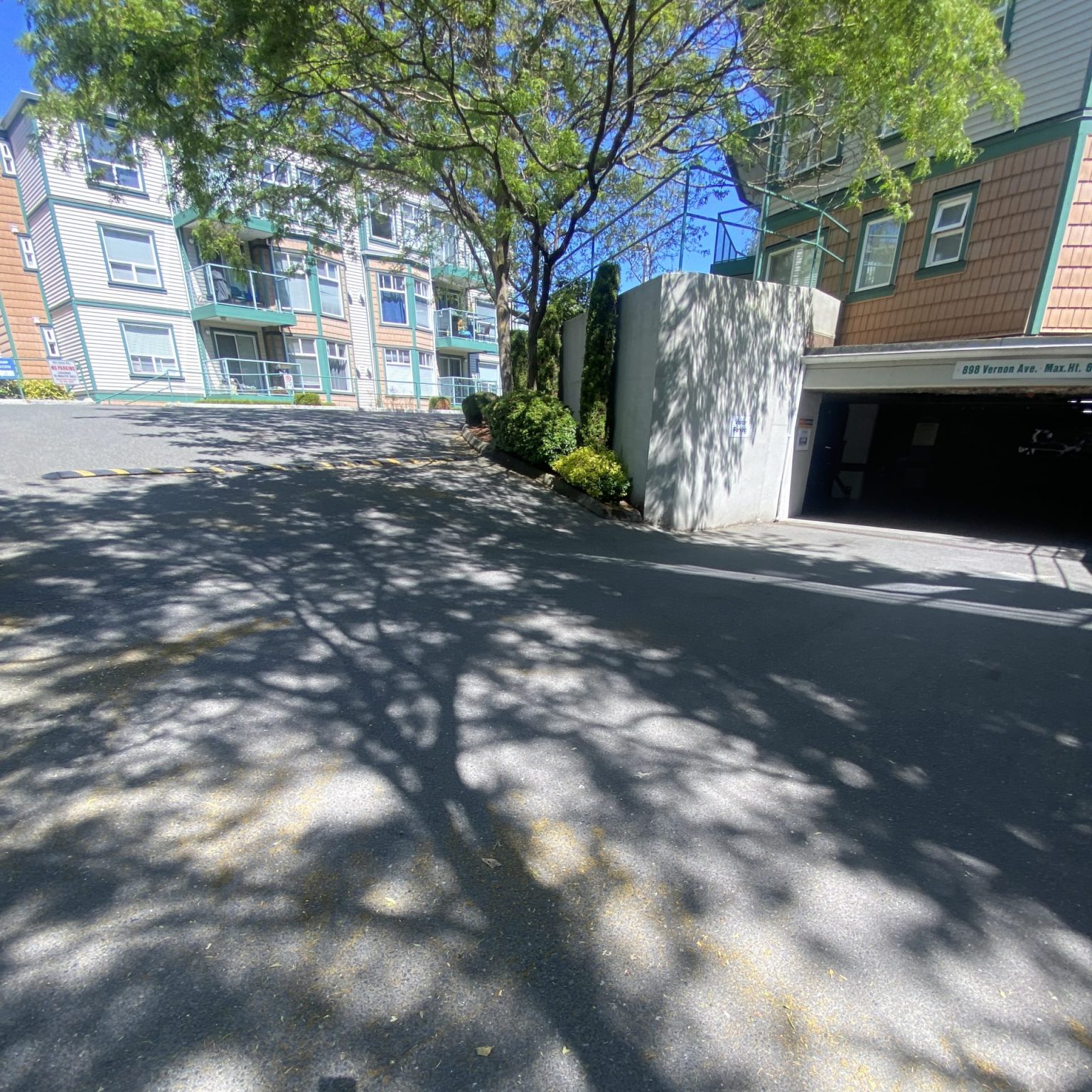 A road leading up from a underground parking garage to the street.